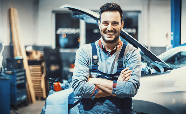 Car Mechanic At Work.